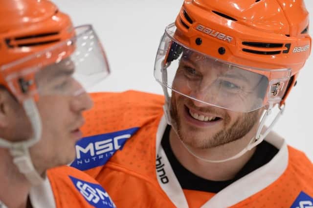 GOOD TO BE BACK: Rob Dowd, right, shares a joke with fellow forward Tanner Eberle. Picture courtesy of Dean Woolley.