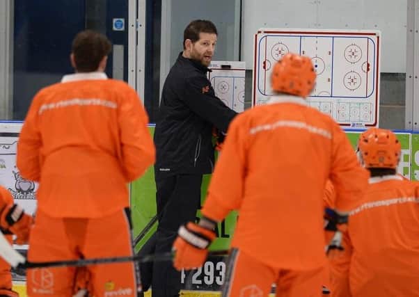NOW HEAR THIS: Sheffield Steelers' head coach Aaron Fox gives his players some instruction during on-ice practice on Monday. Picture courtesy of Dean Woolley.