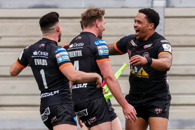 WINNING START: Jordan Turner celebrates with his Castleford Tigers teammates during Sunday's victory over Warrington. Picture: Alex Whitehead/SWpix.com.