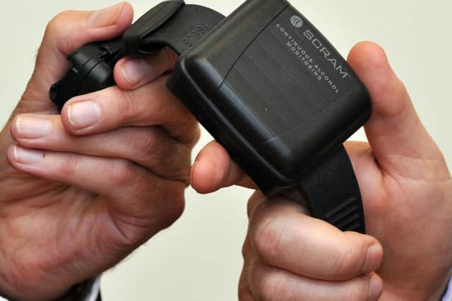 An alcohol monitoring tag, during the launch of the UK's first compulsory sobriety 'tag' programme for people who repeatedly commit alcohol-related crime in 2014. Pic by PA.