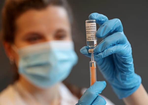 Clinical Pharmacist Ellie Morton prepares to administer the Oxford AstraZeneca COVID-19 Vaccine at a community vaccination centre.