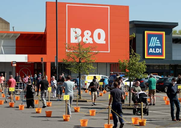 Shoppers queue at a recently re-opened B&Q hardware store on April 24, 2020 in Northampton, United Kingdom. (Photo by David Rogers/Getty Images)