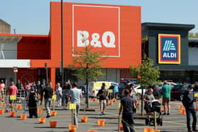 Shoppers queue at a recently re-opened B&Q hardware store on April 24, 2020 in Northampton, United Kingdom. (Photo by David Rogers/Getty Images)