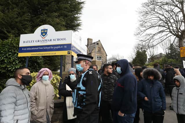 Protesters gathered outside Batley Grammar School in Batley, West Yorkshire, where a teacher has been suspended for reportedly showing a caricature of the Prophet Mohammed to pupils during a religious studies lesson.