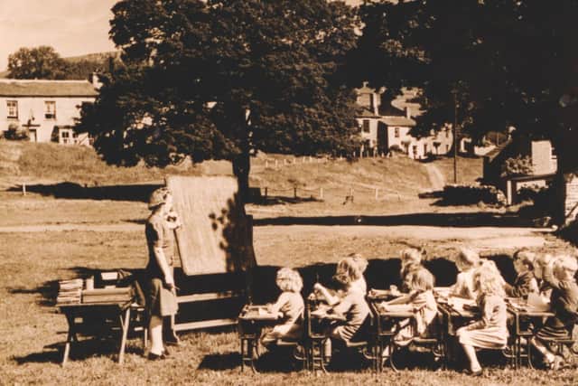 Bainbridge green 'plate' - featured in The Yorkshire Post July 4 1946 with caption 'Picture of a heat wave scene at Bainbridge in Wensleydale. The village schoolmistress takes a class on the green'. Image courtesy of Story of Schools.