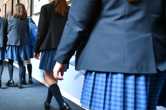 A helpline for people affected by sexual assault and harassment in schools is to be set up as part of an immediate review into the issue, the Government has said