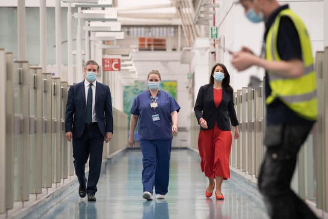 Labour party leader Sir Keir Starmer and Shadow Chancellor of the Duchy of Lancaster, Rachel Reeves chat with nurse Lisa Newell during a visit to Chelsea and Westminster Hospital, London, to thank the NHS staff for their work as the country marks the one year anniversary of the first national lockdown to prevent the spread of coronavirus.