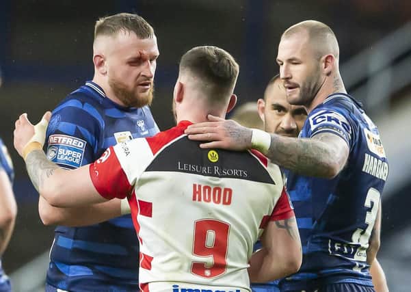 Wigan prop Brad Singleton, left, pictured at the end of last weekend's Super League opener with Leigh Centurions. Picture: Allan McKenzie/SWpix.com.