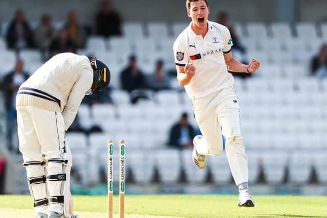 Yorkshire's Matthew Fisher celebrates taking the wicket of Kent's Daniel Bell-Drummond.