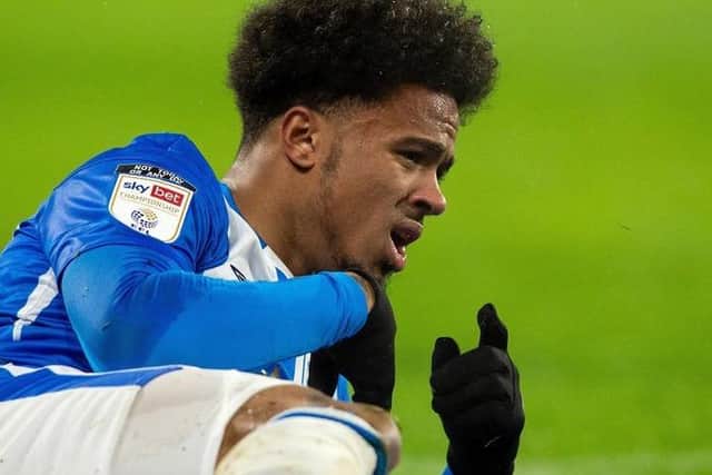 Josh Koroma signals to the best that's it and goes off injured during Huddersfield Town's win over Sheffield Wednesday in December. Picture: Bruce Rollinson.