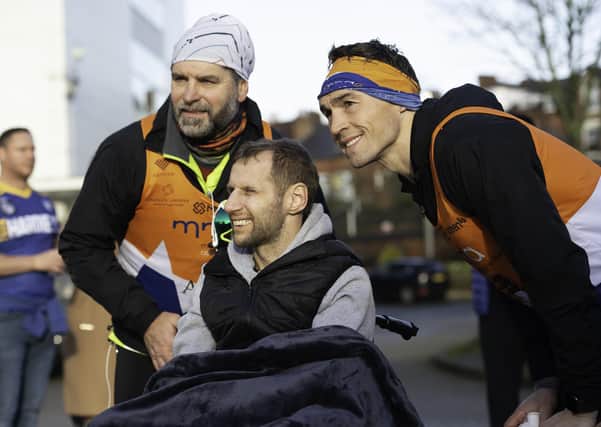 This was Rob Burrow (centre) greeting Kevin Sinfield (right) when the latter ran seven marathons in seven days to raise funds for the MND Association.