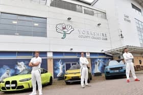 New backers: From left, David Willey, Tom Kohler-Cadmore and Ben Coad with cars from Yorkshire's sponsors.
