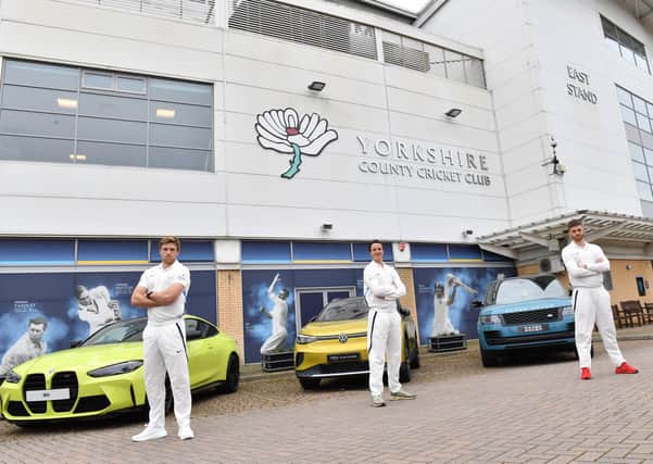 New backers: From left, David Willey, Tom Kohler-Cadmore and Ben Coad with cars from Yorkshire's sponsors.