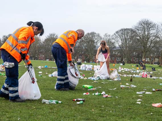 A clean-up operation involving some students, residents and Leeds City Council on Woodhouse Moor, in Headingley, after hundreds of people gathered during the week to enjoy the warm weather. People left behind tons of litter, bottles, food and disposable barbecues. (James Hardisty).
