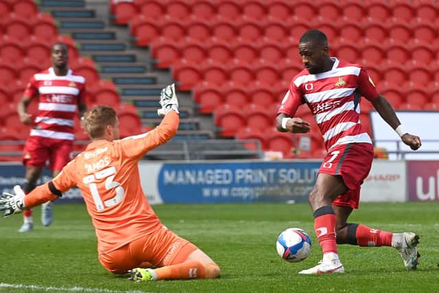 Doncaster's Omar Bogle looks to take the ball round Charlton's keeper Ben Amos (Picture: Andrew Roe/AHPIX LTD)