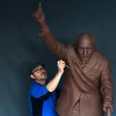Artist Andrian Melka works on his Captain Sir Tom Moore sculpture at his studio near York. Picture : Jonathan Gawthorpe
