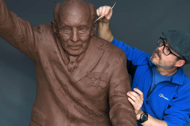 Artist Andrian Melka works on his Captain Sir Tom Moore sculpture at his studio near York. Picture : Jonathan Gawthorpe