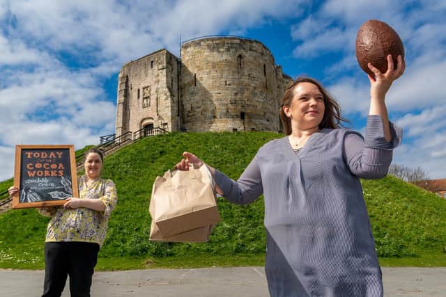 Staff at the York Cocoa House have seen soaring trade online with a growing number of international orders, especially from the USA. General manager Michelle Procter and Sophie Jewett, the company's founder, are pictured in front of Clifford's Tower in York. (Photo: James Hardisty).