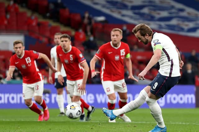 Leading the line: England's Harry Kane scores the first goalfrom the penalty spot against Poland.