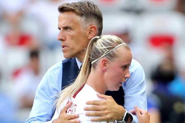 Connections: England head coach Phil Neville hugs Beth Mead. Picture: PA
