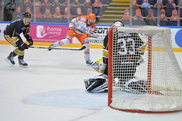 STRIKE ONE: Liam Kirk fires through Ben Bowns for his first of the night to make it 2-0 to Sheffield Steelers over Nottingham Panthers in the Elite Series. Picture courtesy of Dean Woolley.