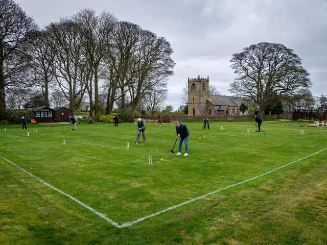 Members of the Beverley & East Riding Croquet Club, were thrilled to be once again practising for their new season at their grounds on the lawns of Rowley Manor Hotel, Little Weighton, Cottingham, near Hull. Pictured Members practising on the lawns with a backdrop of St Peter's Church.
Writer: 	James Hardisty