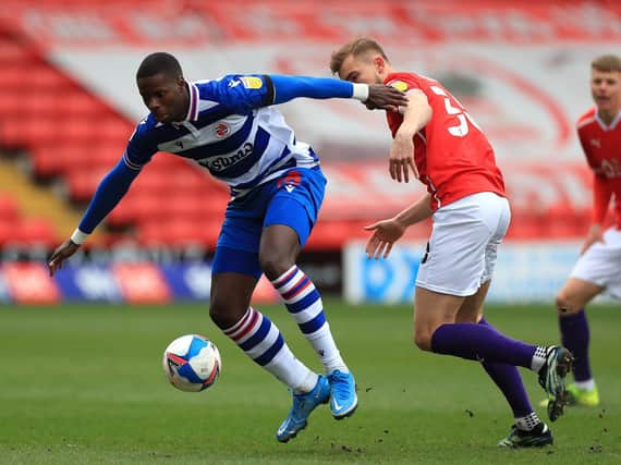 Reading's Lucas Joao nips in front of Barnsley's Michal Helik. Picture: PA