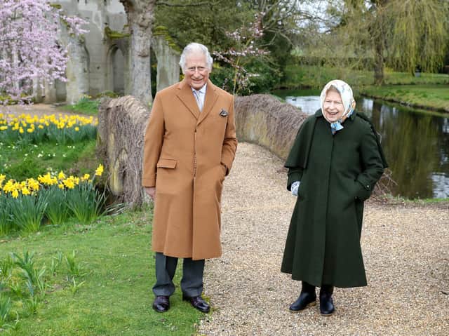 Queen Elizabeth II and the Prince of Wales on March 23, 2021 in the garden of Frogmore House in Windsor,