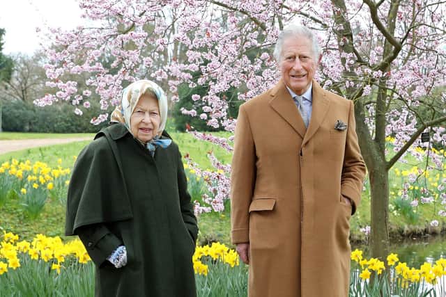 Queen Elizabeth II and the Prince of Wales on March 23, 2021 in the garden of Frogmore House in Windsor,