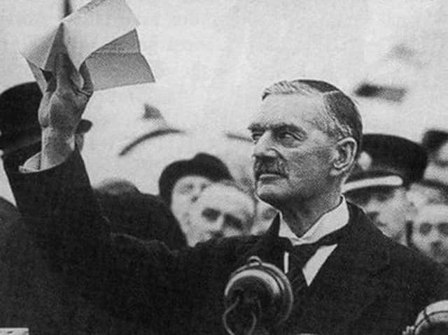 British prime minister Neville Chamberlain in 1938 with his ‘piece of paper’ ensuring peace in Europe. (Image: Shawshots / Alamy Stock Photo)