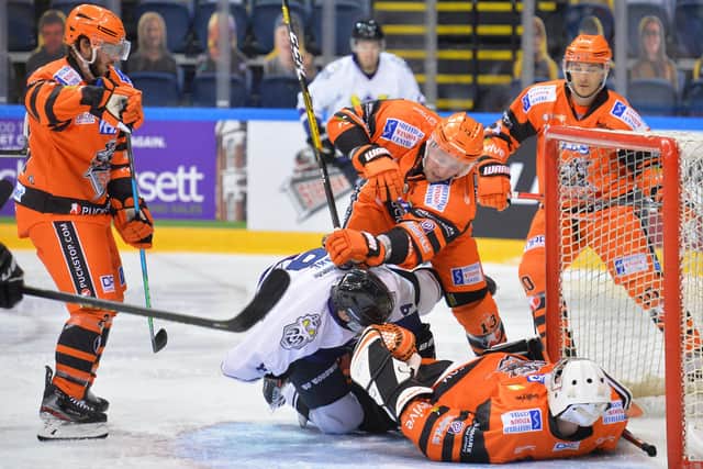 LYING DOWN ON THE JOB: Steelers' goalie Ben Churchfield smothers the puck close to his net. Picture: Dean Woolley.