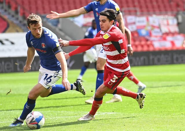 Determined: 
Doncaster's Reece James chasing down the loose ball. Picture: Howard Roe