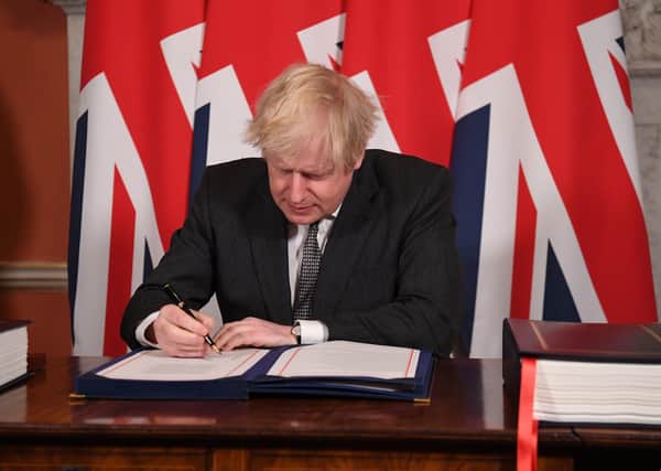 This was Boris Johnson signing the Brexit trade deal with the EU.