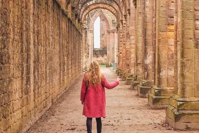 Cat Thomson, known as her alias 'Flying Scots Girl', pictured at Fountains Abbey near Ripon. Picture: Cat Thomson/Instagram
