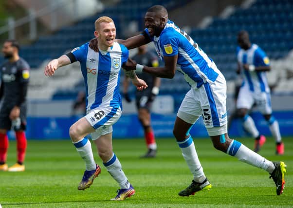 Up and running: Huddersfield Town's Lewis O'Brien, left, celebrates his goal against Brentford.
 Picture Bruce Rollinson