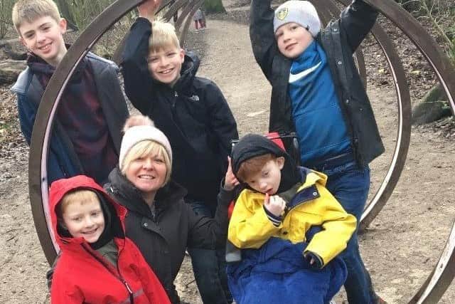 Oliver with his mum and four brothers