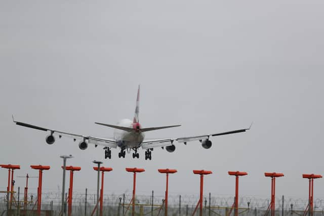 Is an expansion of Heathrow Airpoirt compatible with the Government's policy on climate change?