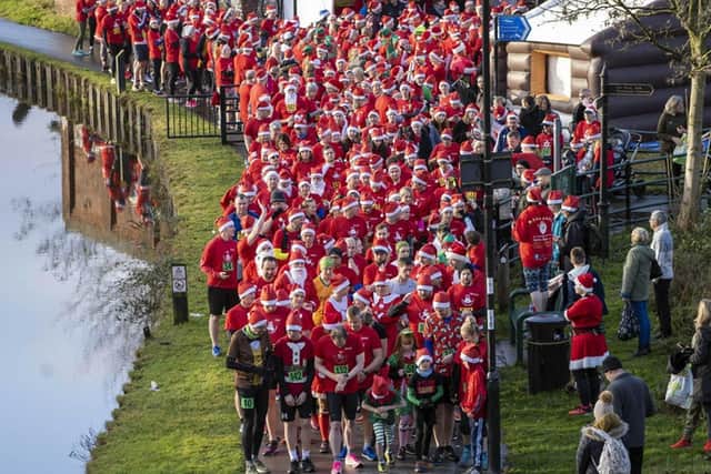 More than 600 peopel took part in this year's Santa Run in Sheffield organised by Mel and Darren Wilkinson Picture: Scott Merrylees