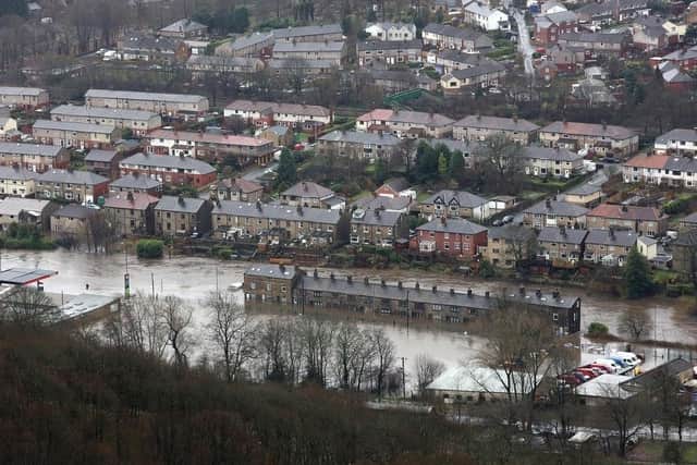 The Government is being urged to offer more help to flood-hit areas like Mytholmroyd.