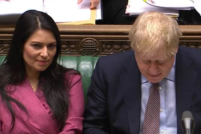 Home Secretary Priti Patel and Prime Minister Boris Johnson during Prime Minister's Questions in the House of Commons. Photo: House of Commons/PA Wire