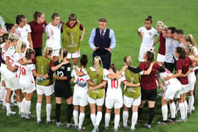 England head coach Phil Neville (centre) talks to the players after the final whistle during the FIFA Women's World Cup Semi Final. Picture: Richard Sellers/PA