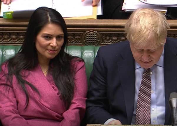 Priti Patel and Boris Johnson during PMQs.