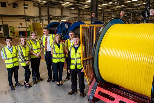 CEO Edward Naylor (centre) and group HR manager Corina Cato (third from right) with trainees at Naylor Industries.