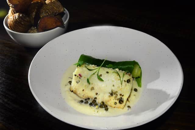 A main course of  Halibut,  Green Peppercorn, Celeriac, Poireaux, Potatoes    at  the  'Fish and Forest' restaurant in York.