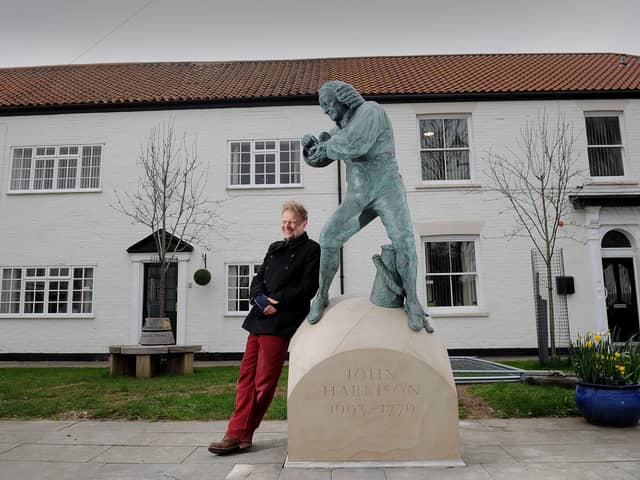 Marcus Cornish with the sculpture he was created of John Harrison at Barrow. Picture by Simon Hulme