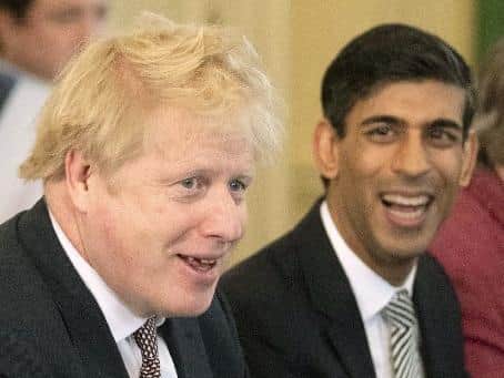 Rishi Sunak alongside Prime Minister Boris Johnson