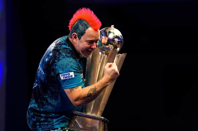 Peter Wright: ‘Snakebite’ with the world championship trophy for a second time.