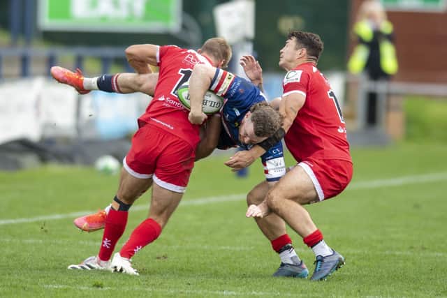 Doncaster Knights Jack Spittle upended by Jersey Reds' Will Brown and Dan Barnes when they met in October. (Picture: Tony Johnson)