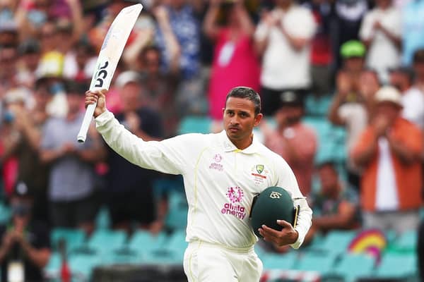 Salute: Australia's Usman Khawaja waves to the crowd after being dismissed.