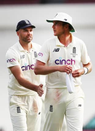 Irreplaceable: England's Stuart Broad, right, is congratulated by James Anderson during day two of the fourth Ashes test at Sydney. Picture: Jason O'Brien/PA Wire.